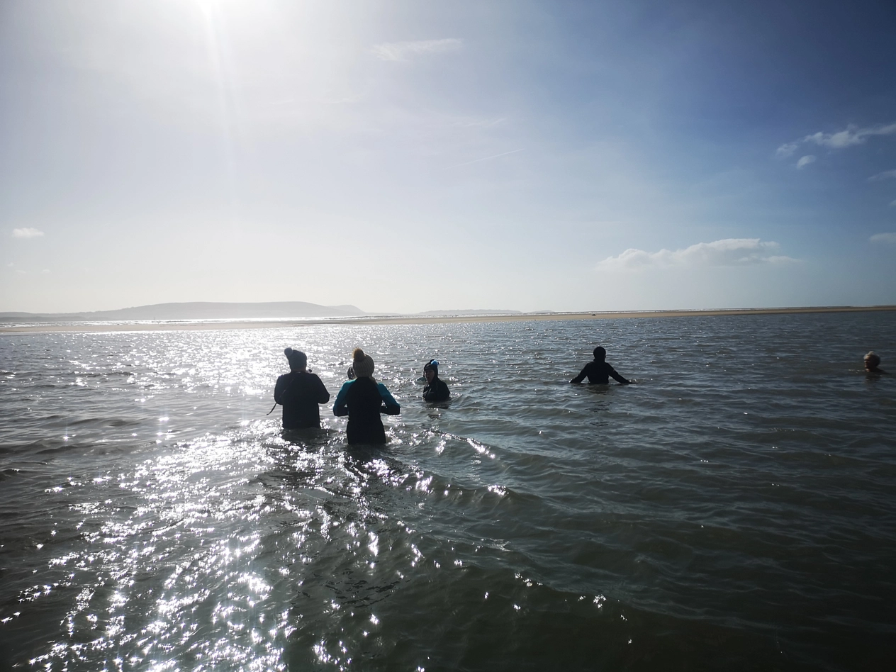 People swimming in sea