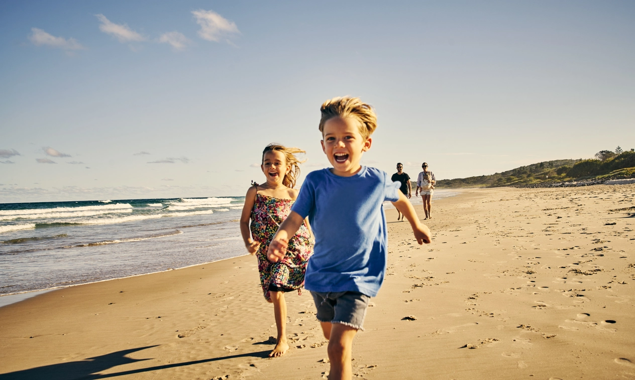 Children running on beach
